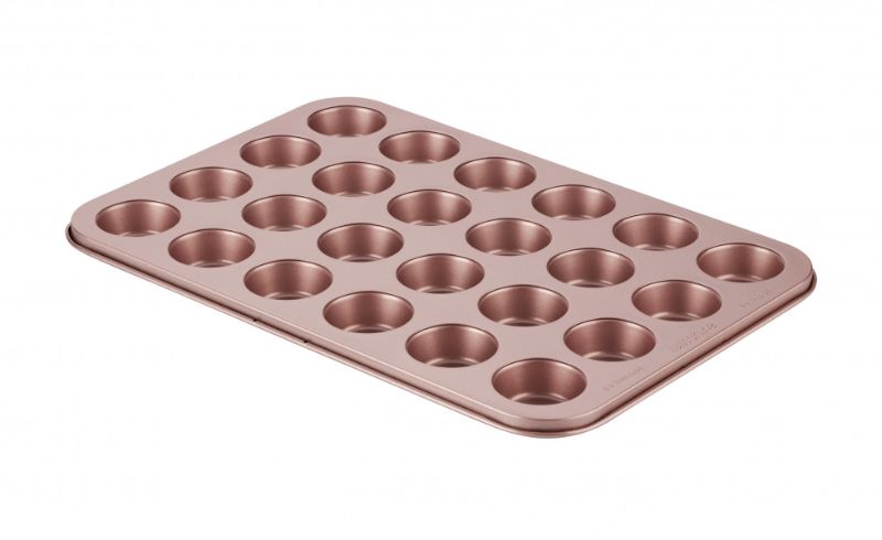 Wiltshire 24-cup muffin pan with rose gold finish, PFOA-free non-stick coating, removable base, and dishwasher safe.