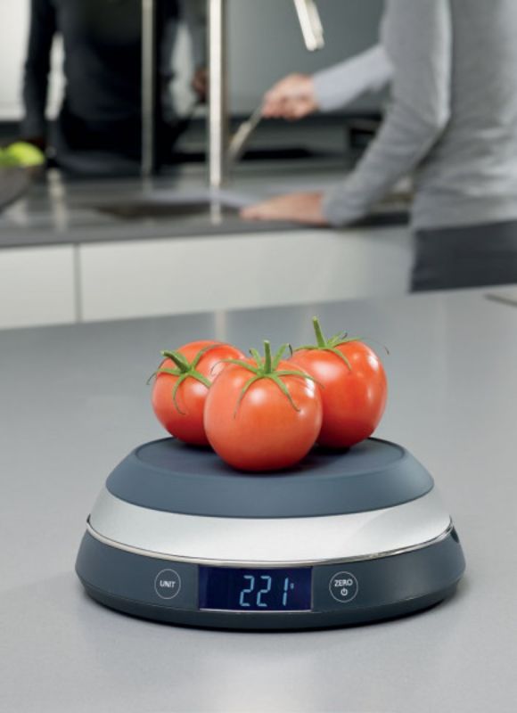 Joseph Joseph Switch Scale in Grey, a digital kitchen scale with a flip lid for versatile weighing and a clear LCD display.