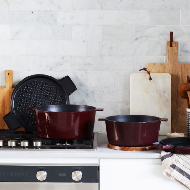 Stanley Rogers 28cm Cast Iron French Oven in Bordeaux color, featuring dual-purpose lid, durable enamel, and wide handles for easy transport.