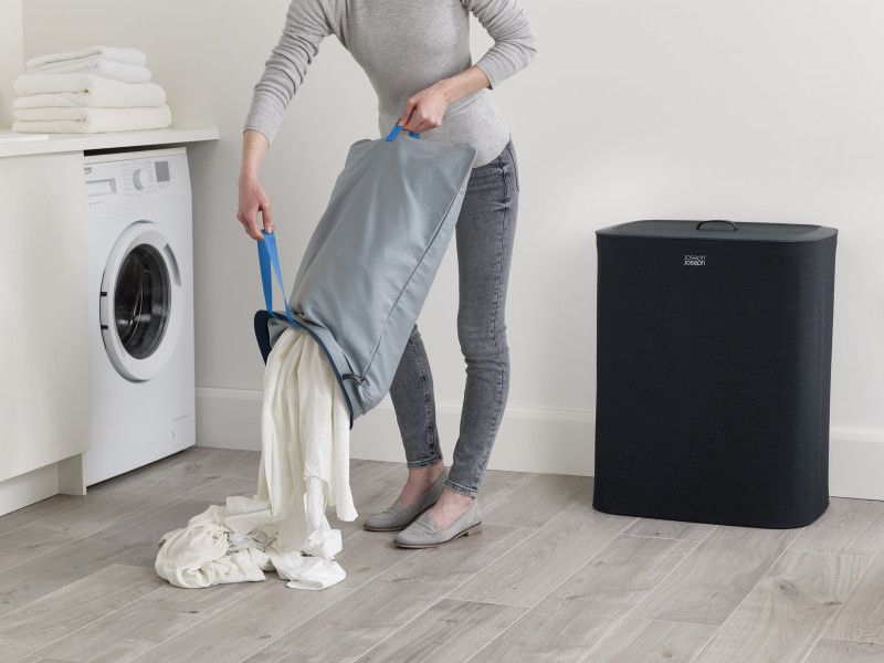 Joseph Joseph Tota 90-litre Laundry Basket in Carbon Black with dual tote bags for easy fabric separation and convenient handles.