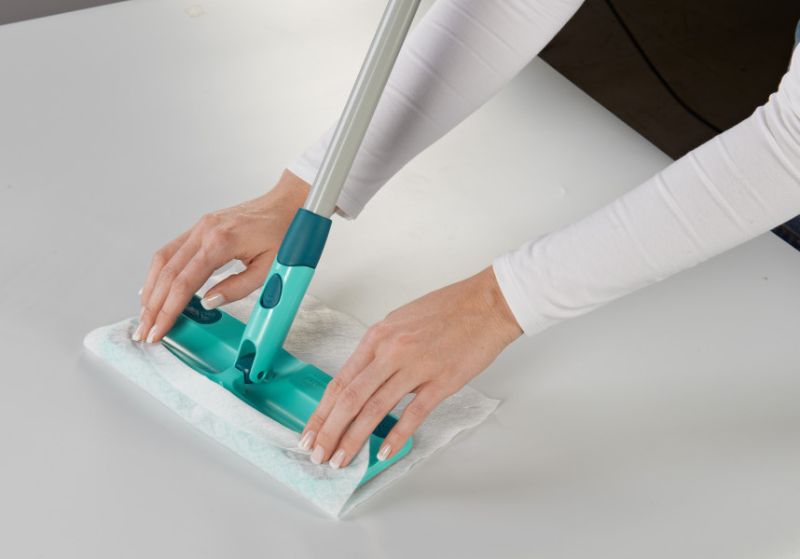 Leifheit Click System Clean & Away Floor Duster with 5 static dust cloths for easy cleaning around furniture.