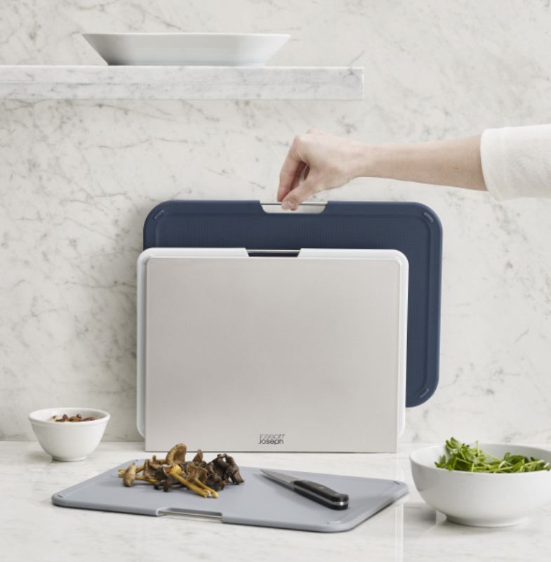 Joseph Joseph Nest Boards Large Set in Grey, featuring three color-coded chopping boards with stainless steel bar and non-slip feet.