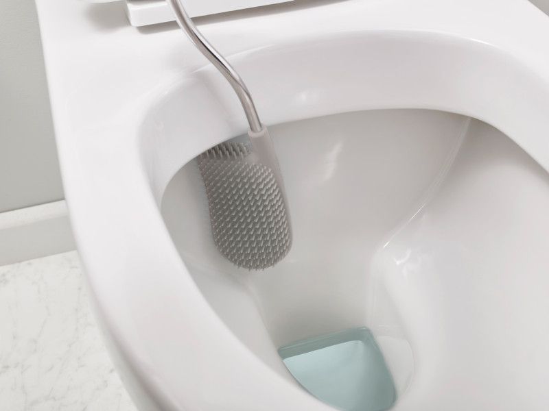 Joseph Joseph Flex Toilet Brush in Grey/White with a D-shaped head for efficient cleaning and anti-drip storage.