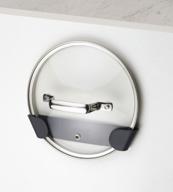 Set of 4 Joseph Joseph pan lid holders for organized kitchen storage, fitting lids 16-24 cm securely in cupboards.