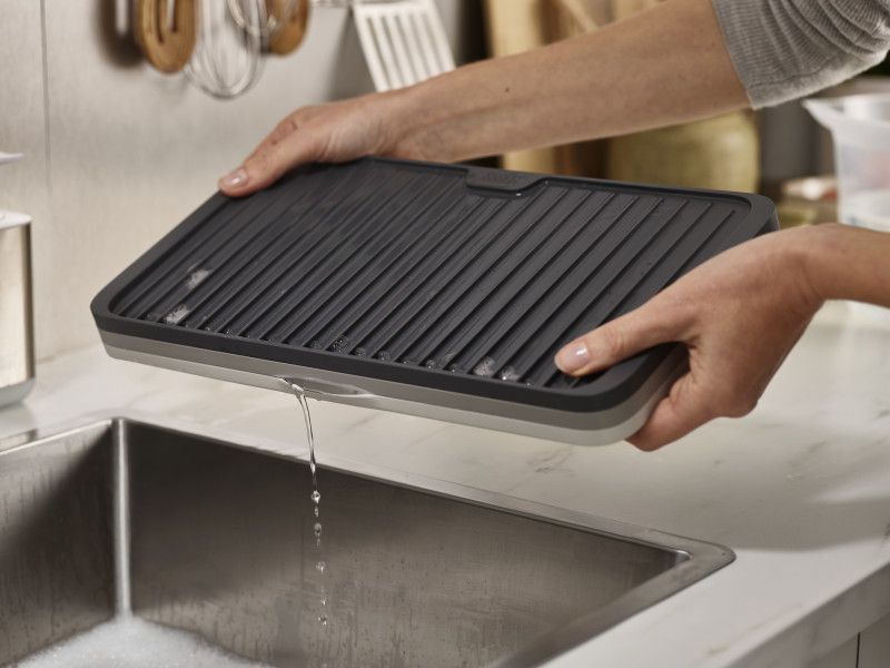 Joseph Joseph Tiered Dish Drainer: collapsible, space-saving design for efficient dish drying with integrated draining spout.