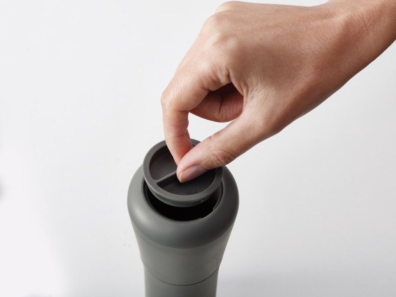 Joseph Joseph Milltop Salt and Pepper Set with inverted design for mess-free seasoning and adjustable grind size.