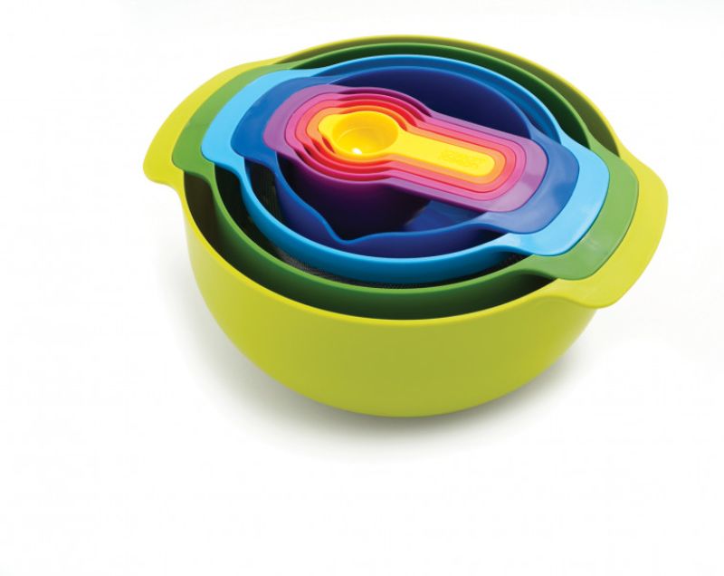 Joseph Joseph Nest 9 Piece kitchenware set featuring space-saving design, mixing bowls, colander, sieve, and measuring cups.