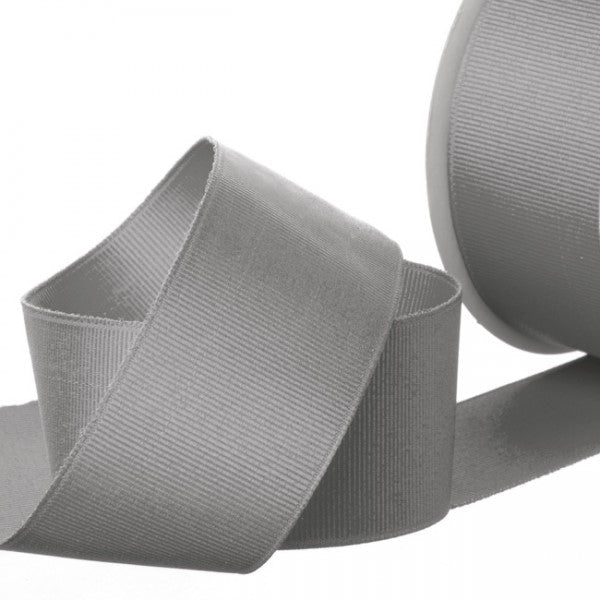 38mm wide charcoal grosgrain ribbon on a 20m roll, ideal for crafts, gift wrapping, and home decor projects.