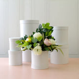 Elegant round white flower box set of 7, perfect for floral arrangements or stylish storage solutions.