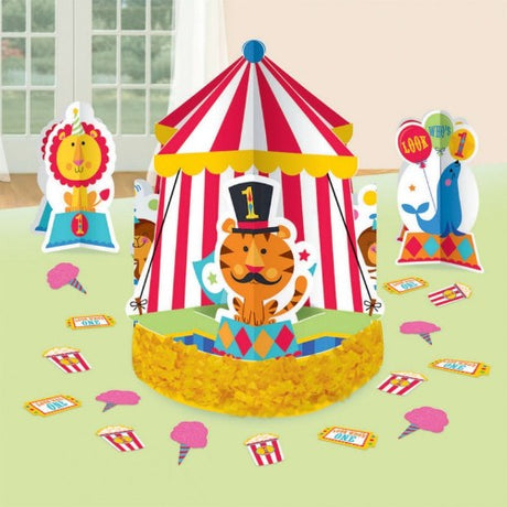 Colorful Fisher Price 1st Birthday Circus table decorations, featuring a fringe centerpiece and 3-D printed accents.