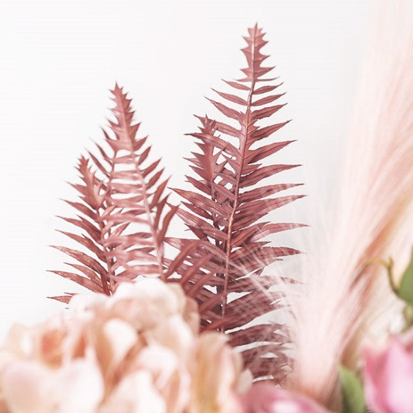 Dusty pink artificial fern spray, 54cm tall, adds whimsical elegance and charm to home decor and floral arrangements.