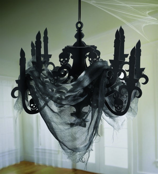 Haunted Mansion candelabra and gauze decoration, perfect for Halloween with an eerie ambiance and ghostly accents.