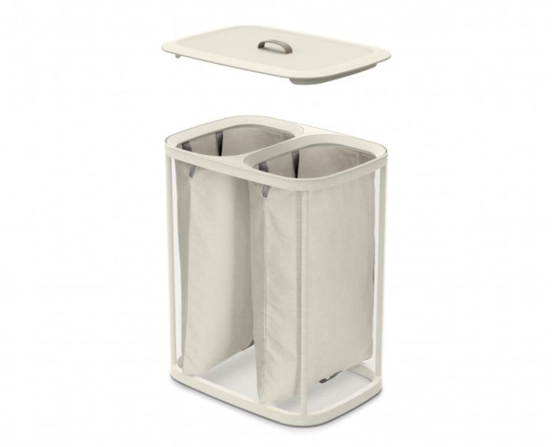 Joseph Joseph Tota 90L laundry basket in ecru with dual compartments for efficient laundry separation and removable fabric totes.