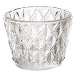 Elegant glass candle holder with diamond pattern, perfect for creating warm ambiance with tea lights or small candles.