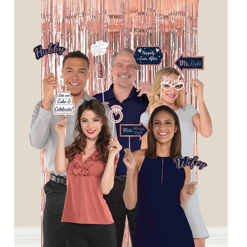 Navy foil backdrop with 20 assorted photo props for stylish party photography.
