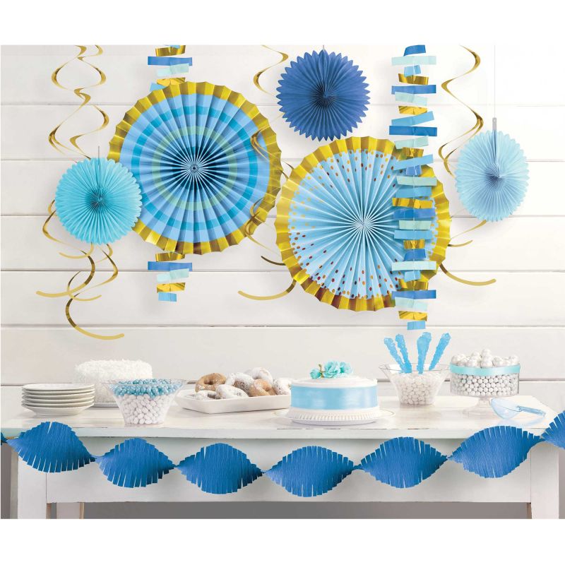 Baby shower boy room decorating kit featuring garlands, fans, and foil swirls for a whimsical celebration of your little prince.