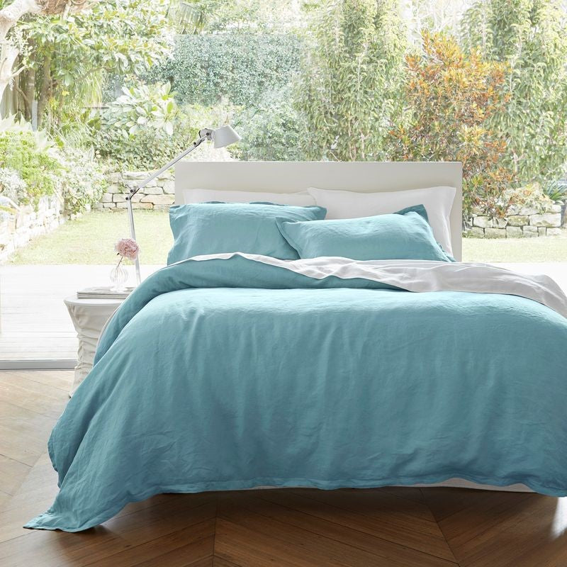 Luxurious blue Baltic linen duvet cover set, featuring a soft finish and includes pillowcases, crafted from 100% European Flax.