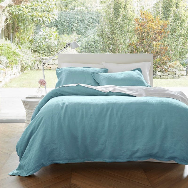 Luxurious blue Baltic linen duvet cover set, featuring a soft finish and includes pillowcases, crafted from 100% European Flax.