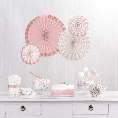Elegant blush wedding paper fans, hot-stamped, in a pack of 4 with varying sizes for chic decor and comfort.