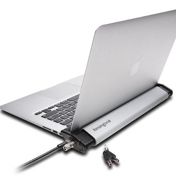 Sleek brushed aluminum locking station for laptops, featuring adjustable arms and non-invasive locking technology.