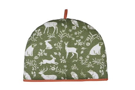 Whimsical sage green tea cosy featuring woodland animals in a block print design, eco-friendly and stylish for tea time.