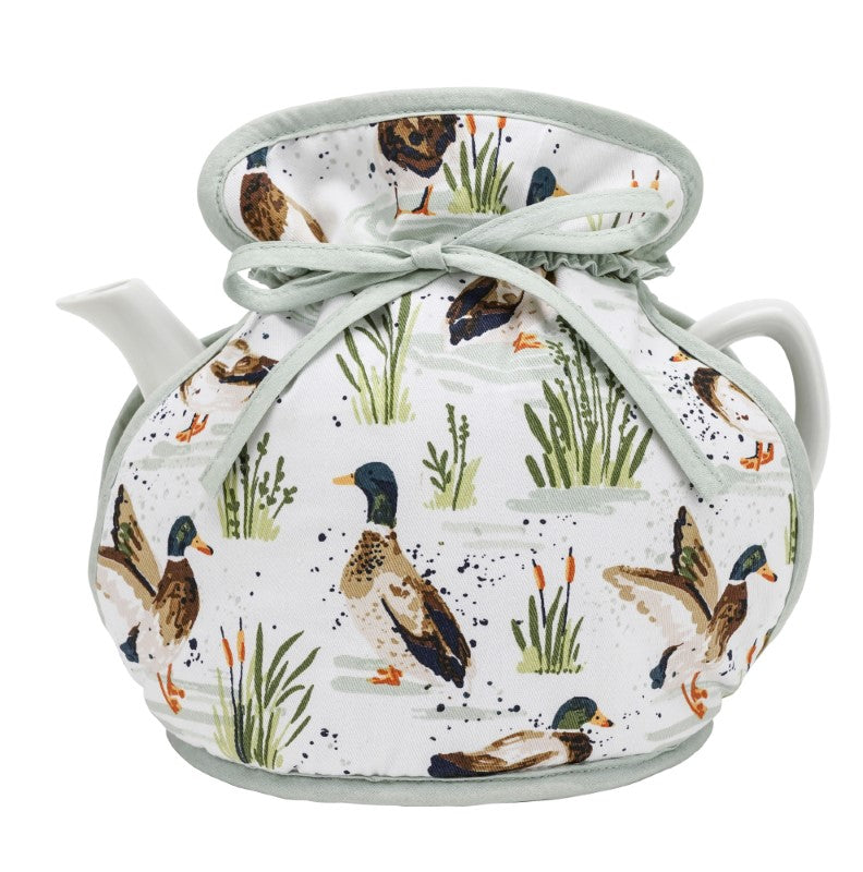 Cozy cotton tea cosy featuring whimsical ducks on a sage green background, perfect for farmhouse kitchen decor.