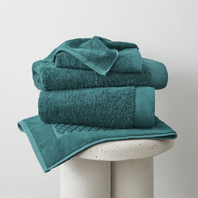 Teal bamboo bath mat from BAKSANA, 51 x 76cm, eco-friendly, soft, absorbent, and perfect for sensitive skin.