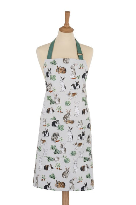 Ulster Weavers cotton apron featuring playful rabbit illustrations, eco-friendly materials, and adjustable fit for kitchen use.