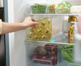 Joseph Joseph FridgeStore Shelf Divider with suction cups for organized fridge space, made from BPA-free materials.