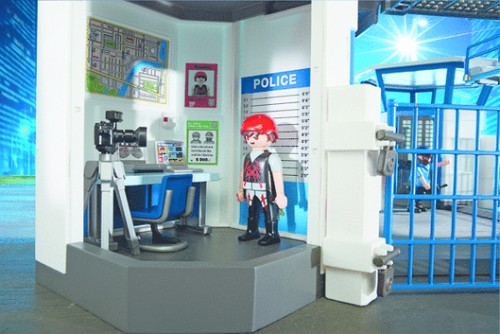 Playmobil Police Headquarters playset with prison, including figures, accessories, and realistic features for imaginative role play.