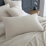 Kayo Linen Pillowsham Pair featuring modern geometric embroidery in stone and charcoal, 100% cotton for chic bedroom decor.