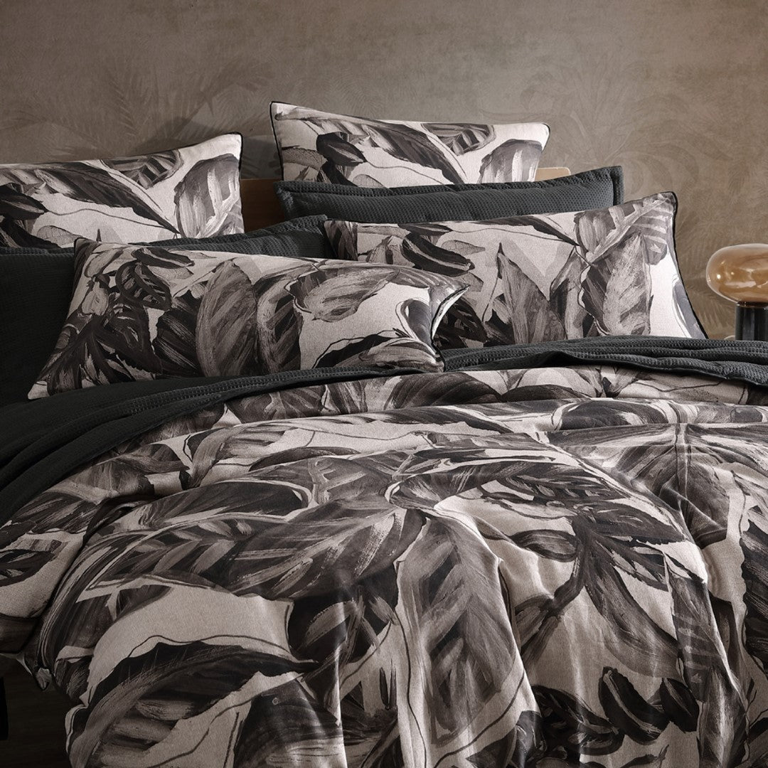 King duvet cover set featuring lush foliage on a textured linen-style background in soft, durable cotton sateen.