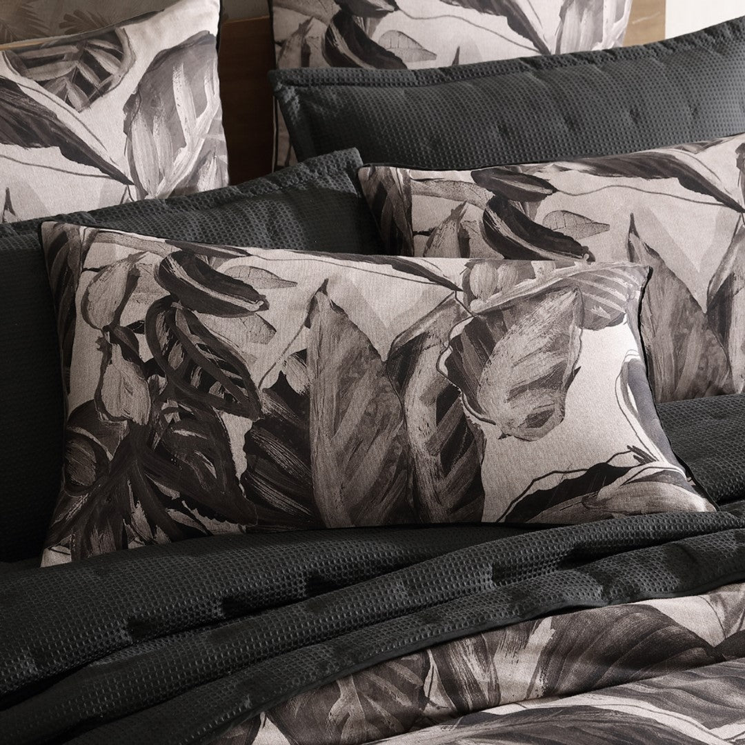 King Duvet Cover Set featuring lush foliage design, 100% Cotton Sateen for comfort, with elegant ikat reverse and refined piping.