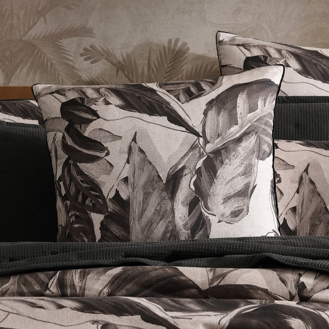 Logan Mason Elio Black European pillowcase featuring exotic foliage on linen-textured cotton sateen for ultimate comfort.