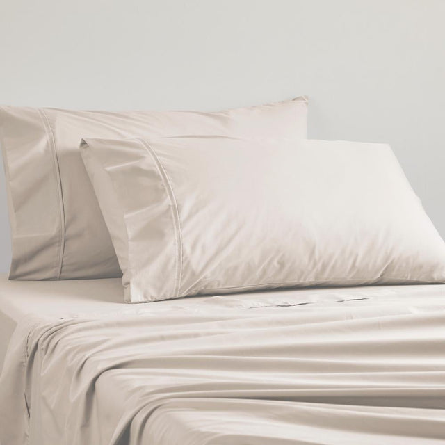 Linen-colored standard pillowcase featuring a soft 50/50 cotton-polyester blend and sturdy percale weave for durability.