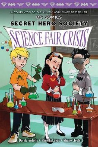 Exciting paperback adventure featuring Clark Kent, Bruce Wayne, and Diana Prince at a thrilling science fair.