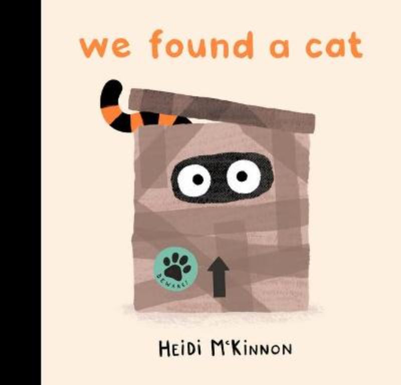 Hardcover picture book titled 'We Found a Cat' featuring illustrations of a cat with whiskers and a long tail.