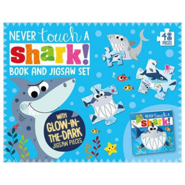 Boxed set featuring a shark-themed storybook and a 48-piece glow-in-the-dark jigsaw puzzle for young children.