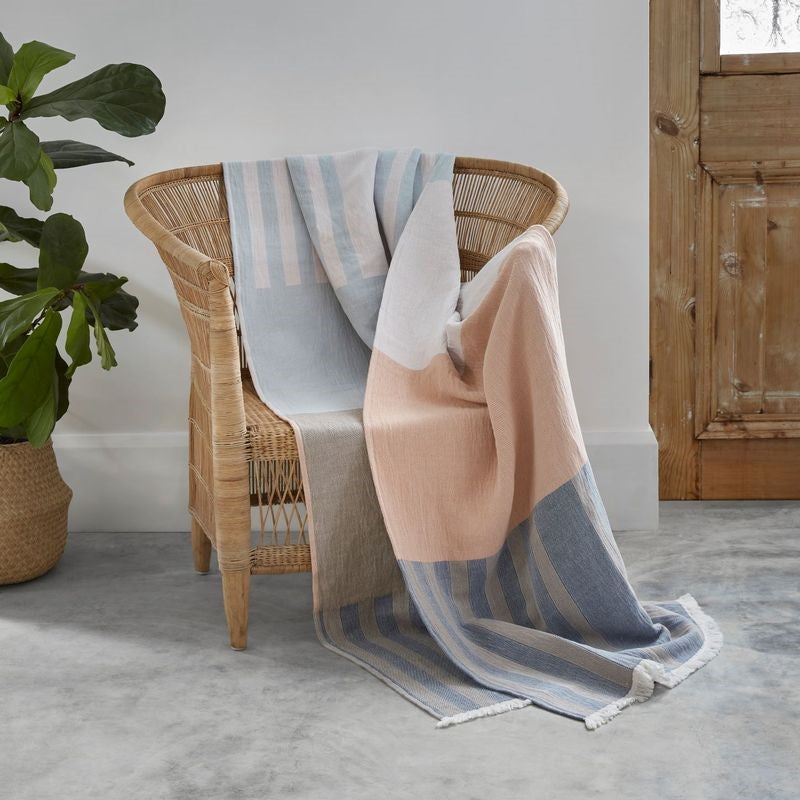 Elegant CENSO throw by BAKSANA, 130 x 170 cm, in soft, stonewashed cotton with fringe and pastel hues for cozy decor.