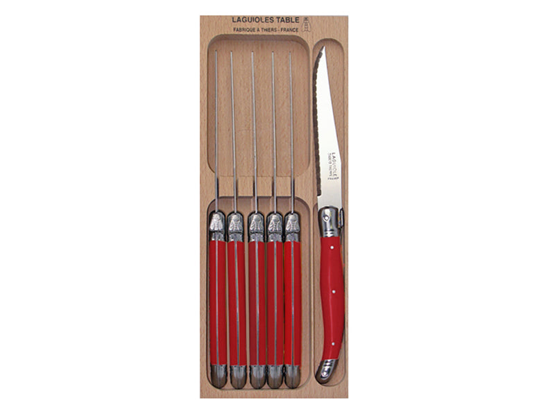 Verdier Knife Set of 6 in bright red with stainless steel blades and ergonomic handles, elegantly displayed in a wooden tray.