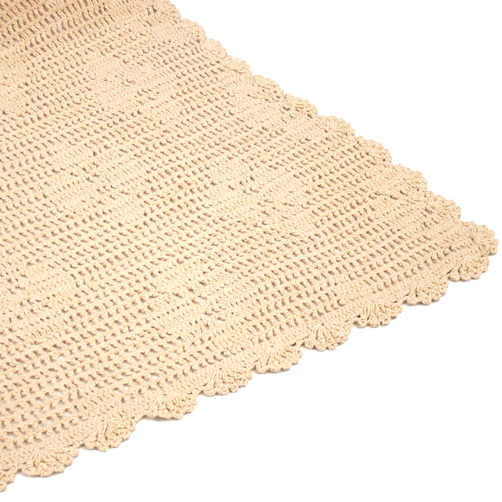 Hand-crocheted cotton throw in custard with floral motif, perfect for cozying up your living space.