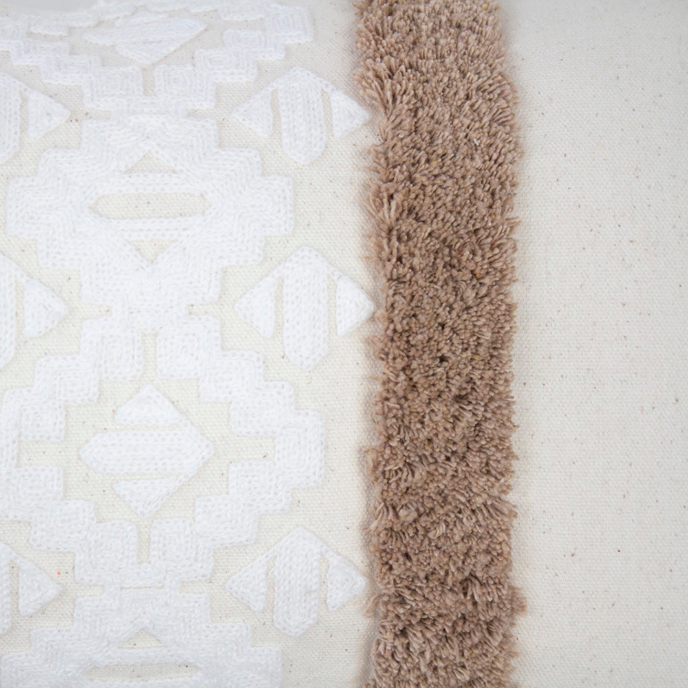 Sedona Rectangle Cushion in Cappuccino features geometric embroidery and soft tufting, perfect for adding style and comfort.