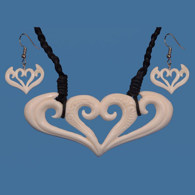 Handcrafted Bone Koru Necklace and Earring Set, symbolizing growth and nature with adjustable cord and timeless design.