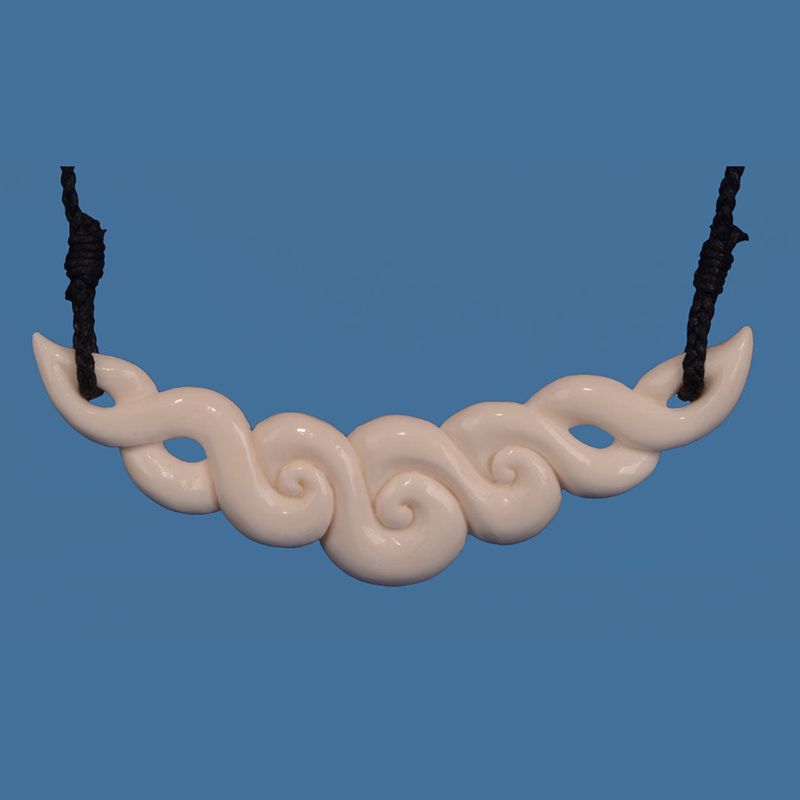 Handmade Maori bone necklace featuring a Koru motif, symbolizing new beginnings and crafted with traditional artistry.