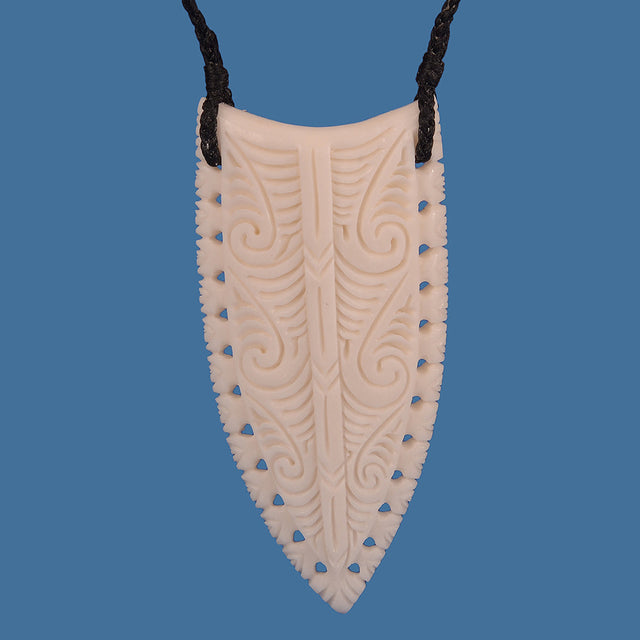 Hand-carved bone spearhead carving, 36mm wide and 76mm tall, showcasing unique indigenous artistry and craftsmanship.