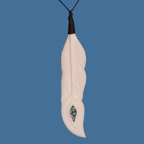 Bone Feather Pendant featuring vibrant Paua shell inlay, handcrafted from premium beef bone, celebrating Maori artistry.