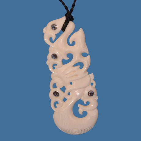 Intricately carved Multi Manaia Pendant made of premium bone, symbolizing Maori protection and spirituality on an adjustable cord.