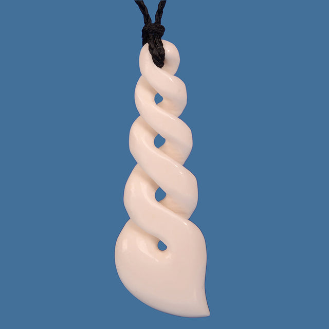 Handcrafted Bone Quad Twist Pendant, showcasing Maori artistry with a unique twist design, on an adjustable black braided cord.