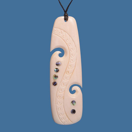 Stunning Bone Drop Pendant featuring Paua Shell inlay, 85mm long, on adjustable cord, inspired by Koru symbolizing growth.