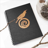 Kiwiana Black Journal featuring Tui bird on Koru design, perfect for writing and creativity with 120 acid-free pages.